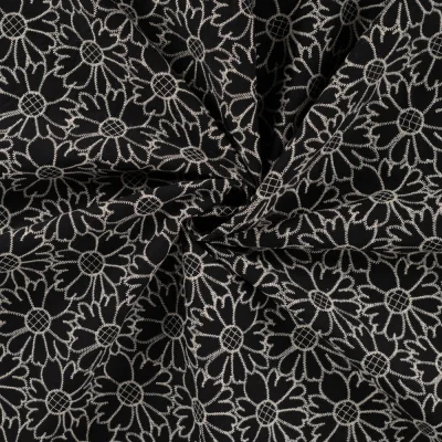 Tissu Coton brodé imprimé Fleurs sur fond Noir - Par 10 cm