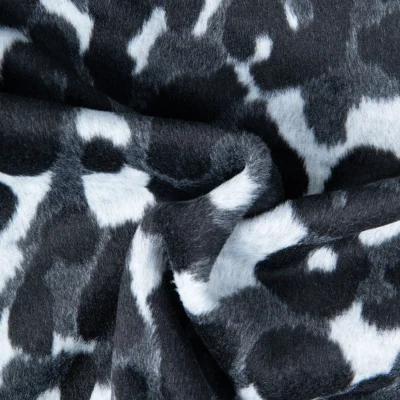 Tissu Maille Jacquard brossé imprimé Léopard noir sur fond Blanc - Par 10 cm