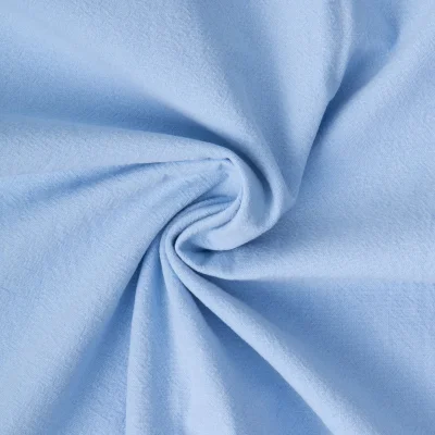 Tissu Coton Lavé aspect Lin uni Bleu ciel - Par 10 cm