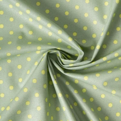 Tissu Coton enduit petits points Jaune sur fond Vert amande - Par 10 cm