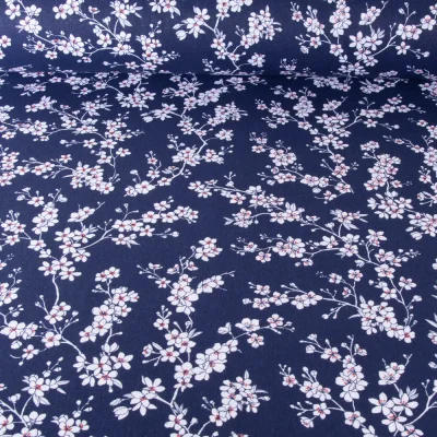 Tissu Coton imprimé Fleur d&#039;amandier sur fond Bleu marine - Par 10 cm