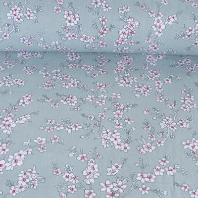 Tissu Coton imprimé Fleur d&#039;amandier sur fond Vert menthe - Par 10 cm