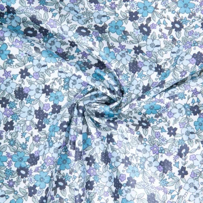 Tissu Coton enduit Agatha fleuris Bleu sur fond Blanc - Par 10 cm