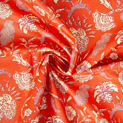 Tissu Coton enduit Agra fleuris sur fond Orange - Par 10 cm