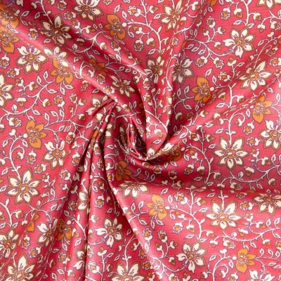 Tissu Coton enduit Goa fleuris sur fond Framboise - Par 10 cm