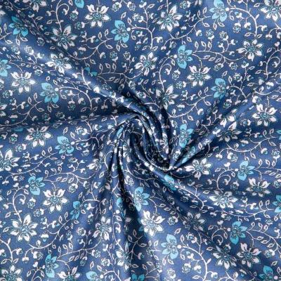 Tissu Coton enduit Goa fleuris sur fond Bleu foncé - Par 10 cm
