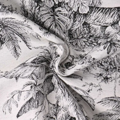 Tissu Jacquard Daktari inspiration toile de Jouy scène tropicale noir sur fond Blanc - Par 10 cm