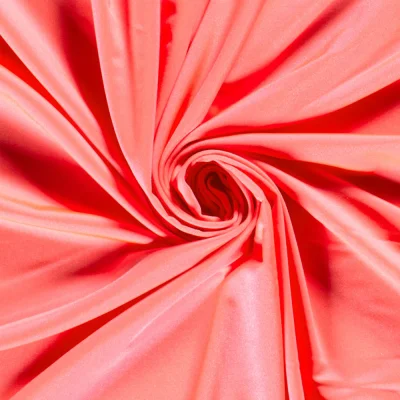 Tissu Lycra brillant uni Corail - Par 10 cm