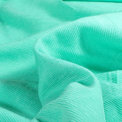 Tissu Viscose uni Rayures texturées sur fond Bleu lagon - Par 10 cm