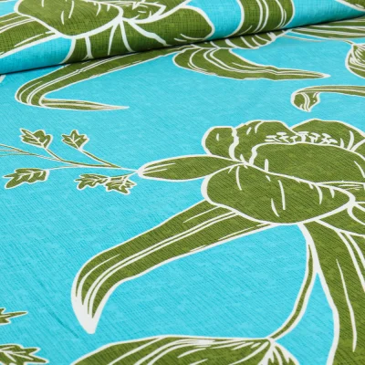 Tissu Viscose Hawa vert sur fond Bleu turquoise - Par 10 cm
