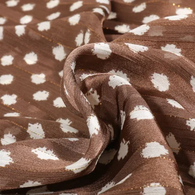 Tissu Mousseline Dots Lurex blanc sur fond Marron - Par 10 cm