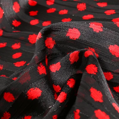 Tissu Mousseline Dots Lurex rouge sur fond Noir - Par 10 cm