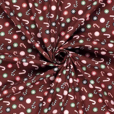 Tissu Coton imprimé Candy sucrerie de Noël sur fond Marron - Par 10 cm