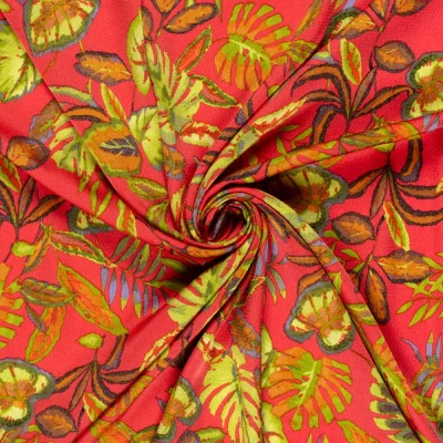 Tissu Satiné bubble Feuilles vertes sur fond Rouge - Par 10 cm