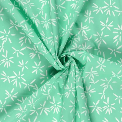 Tissu Coton extensible Pissenlit mode sur fond Vert menthe - Par 10 cm
