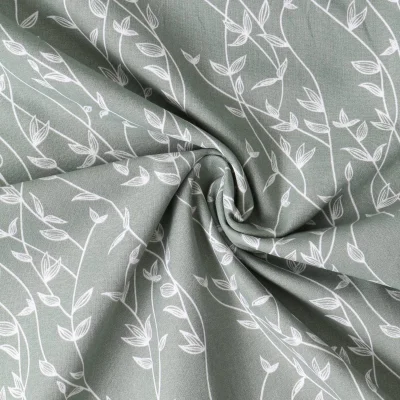 Tissu Popeline de Coton  feuilles Alexia sur fond Vert kaki clair - Par 10 cm