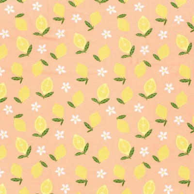 Tissu Lycra maillot de bain citron Zestiva jaune sur fond Pêche - Par 10 cm