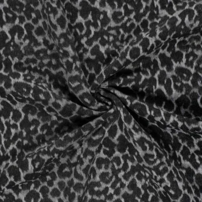 Tissu Jacquard toucher laine Éris léopard Noir sur fond Gris clair - Par 10 cm