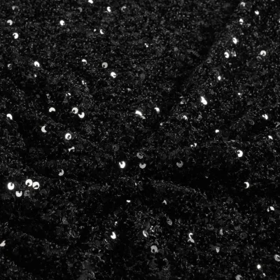 Tissu Sequins Cosmos sequins Argentés sur fond Noir - Par 10 cm