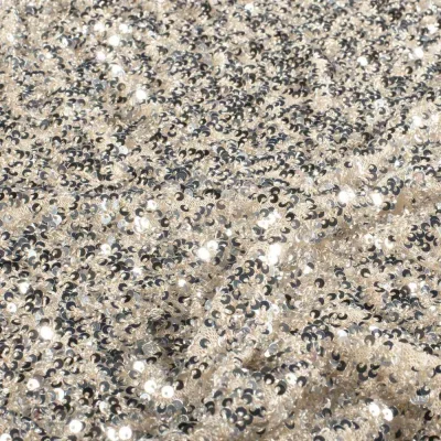 Tissu Sequins Cosmos sequins Argentés sur fond Beige nacré - Par 10 cm