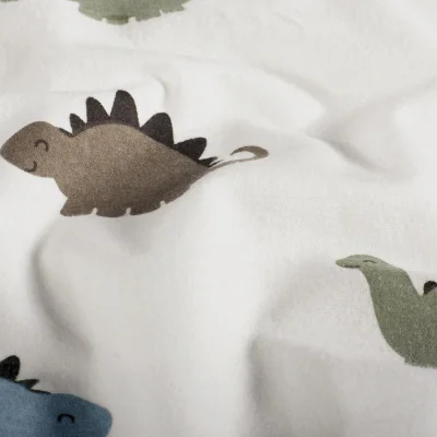 Tissu Flanelle de Coton Zoé dinos Kaki, Brun et Bleu sur fond Ecru - Par 10 cm