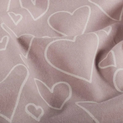 Tissu Flanelle de Coton Emy cœurs Blanc sur fond Rose poudré - Par 10 cm