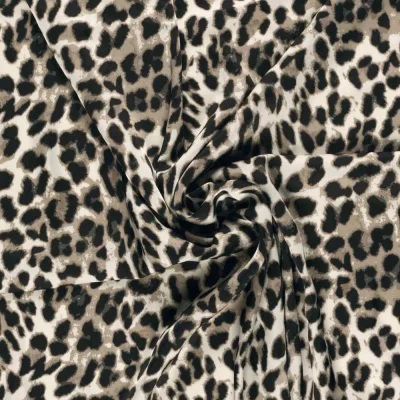 Tissu Satin Duchesse Felindra motifs léopard sur fond Blanc - Par 10 cm