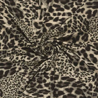 Tissu Jersey Viscose digital motif léopard Brun et Noir sur fond Grège - Par 10 cm