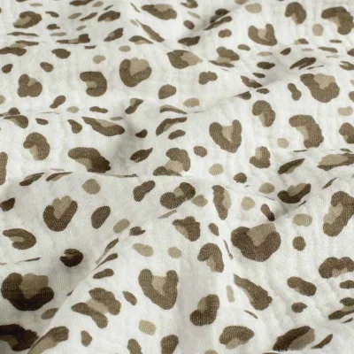 Tissu Double gaze de Coton motif panthère Taupe et Beige sur fond Blanc cassé - Par 10 cm