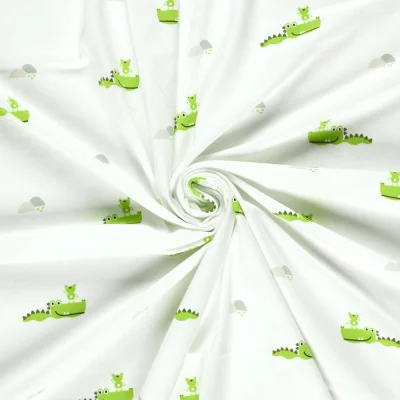 Tissu Jersey Coton imprimé Croco vert sur fond Ecru - Par 10 cm