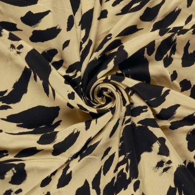 Tissu satin de viscose  imprimé tacheté noir sur fond Jaune - Par 10 cm