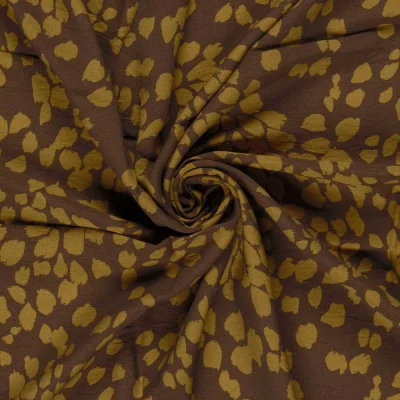 Tissu crêpe de viscose imprimé Fleuris or sur fond Marron - Par 10 cm
