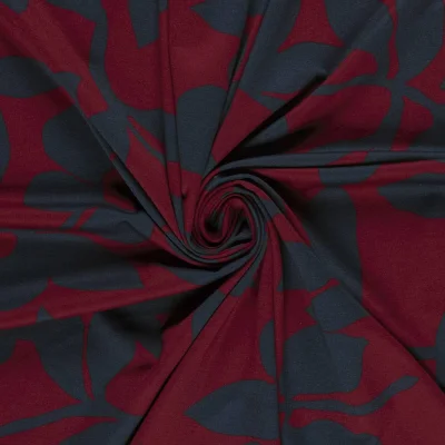 Tissu Jersey Milano imprimé motifs Fleurs bleu marine sur fond Bordeaux - Par 10 cm
