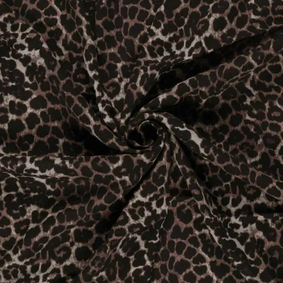 Tissu Crêpe de Viscose Eve panthère sur fond Noir - Par 10 cm