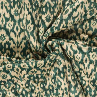 Tissu velours matelassé imprimé envers uni motif ethnique sur fond Vert - Par 10 cm