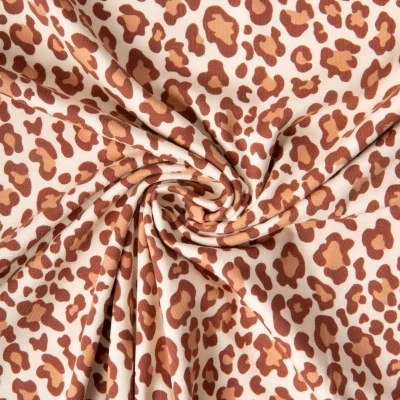 Tissu Jersey Coton imprimé tacheté Léopard Terracota et Brun sur fond Beige - Par 10 cm