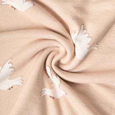 Tissu Maille Jersey Coton Ana colombes Blanc sur fond Beige - Par 10 cm