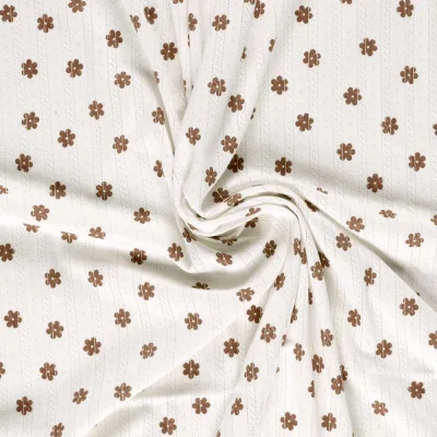 Tissu Jersey 100% Coton ajouré Baby petites fleurs sur fond Ecru - Par 10 cm