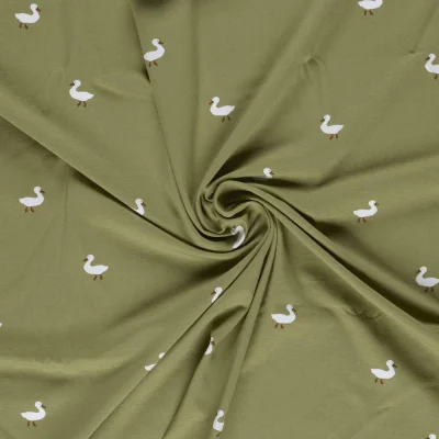 Tissu Jersey Coton imprimé Tom petits canards sur fond Vert olive - Par 10 cm