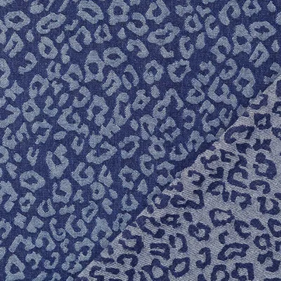 Tissu Jean Jacquard motif léopard Blanc sur fond Bleu denim - Par 10 cm