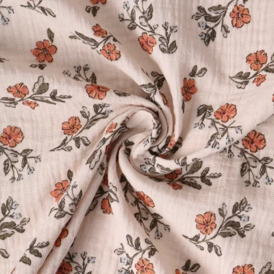 Tissu Double gaze de Coton Maëlysanne fleurs Oranges - Par 10 cm