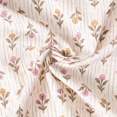Tissu Double gaze de Coton Aesa petites fleurs Rose et Abricot sur fond Blanc cassé - Par 10 cm