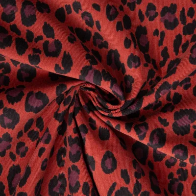 Tissu Velours milleraies imprimé Azara léopard noir sur fond Terracotta - Par 10 cm