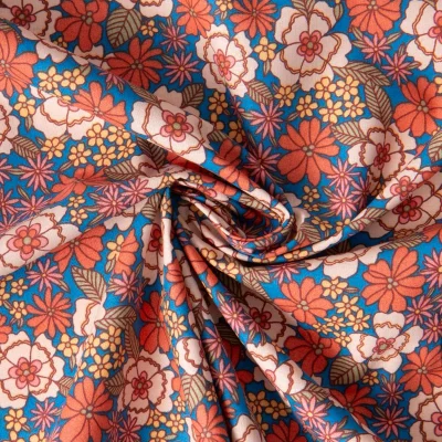Tissu Coton imprimé Arty Fleuri Betti sur fond Bleu - Par 10 cm