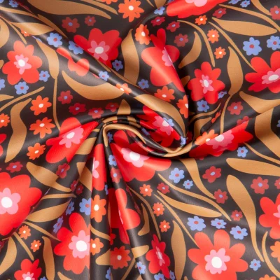 Tissu Imperméable imprimé Beyonce fleuris rouge sur fond Noir - Par 10 cm