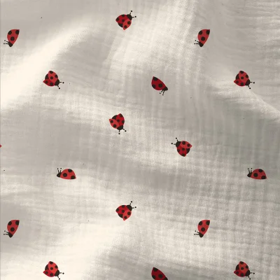 Tissu Double gaze Coton Coccinelles rouges sur fond Blanc cassé - Par 10 cm
