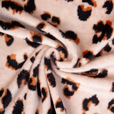 Tissu Doudou imprimé Tigrou Léopard Noir et Caramel sur fond Beige - Par 10 cm