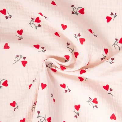 Tissu Double gaze de Coton Ilove coeurs rouges sur fond Rose pâle - Par 10 cm