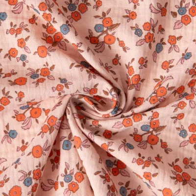 Tissu Double gaze de Coton Fleuris June sur fond Pêche - Par 10 cm