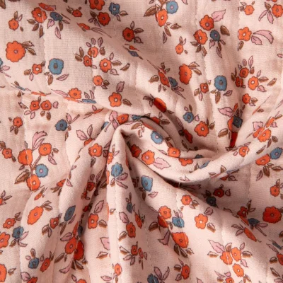 Tissu Double gaze de Coton Matelassé Fleuris réversible Seersucker rayé sur fond Rose pâle - Par 10 cm